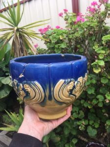 The 1930s blue ceramic planter Eden found in her Malvern backyard. It was glued together, and she has kept it with her since.